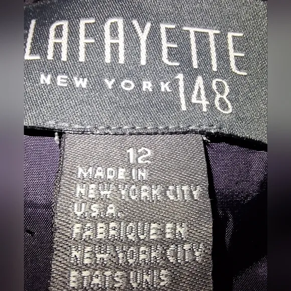 A Lafayette 148 New York dark purple wool blend blazer in a ladies size 12.